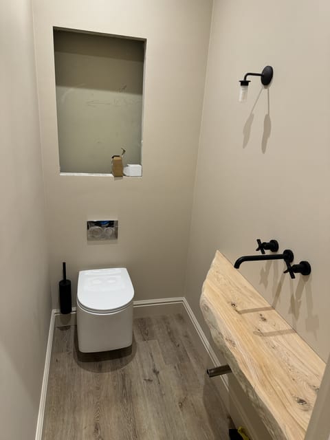 Family bathroom renovation with bath and shower, East London