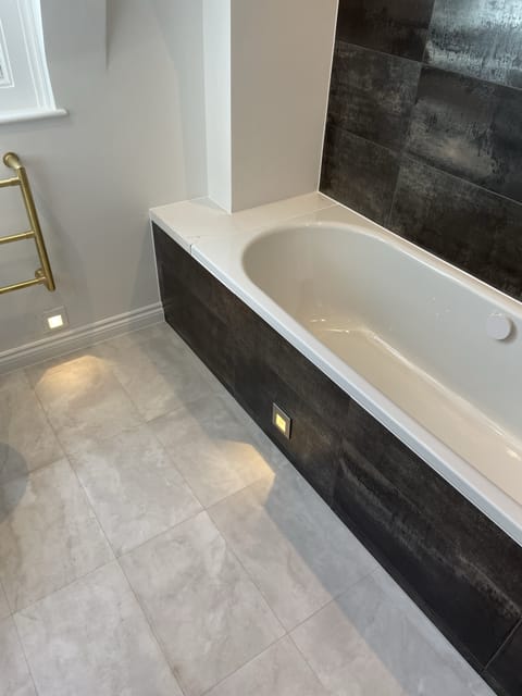 Bespoke en-suite with feature wall tiling, Essex