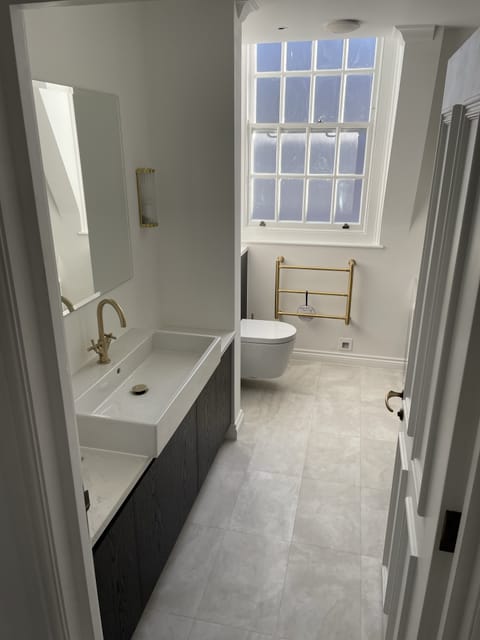 Modern wet room with porcelain floor tiles, Essex