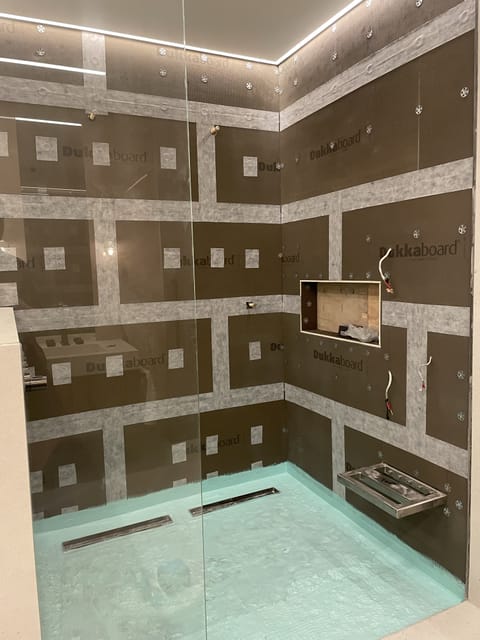 Bathroom renovation with stone effect tiles, East London