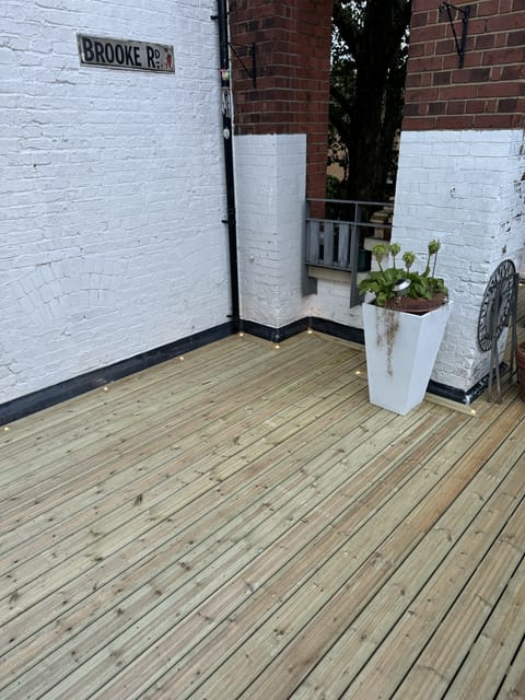 Hardwood decking with glass balustrade, East London