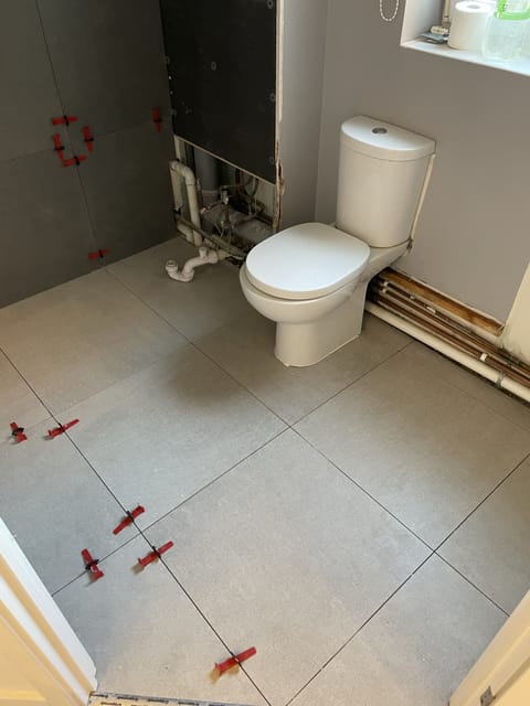 Porcelain floor tiling in kitchen extension, Chingford