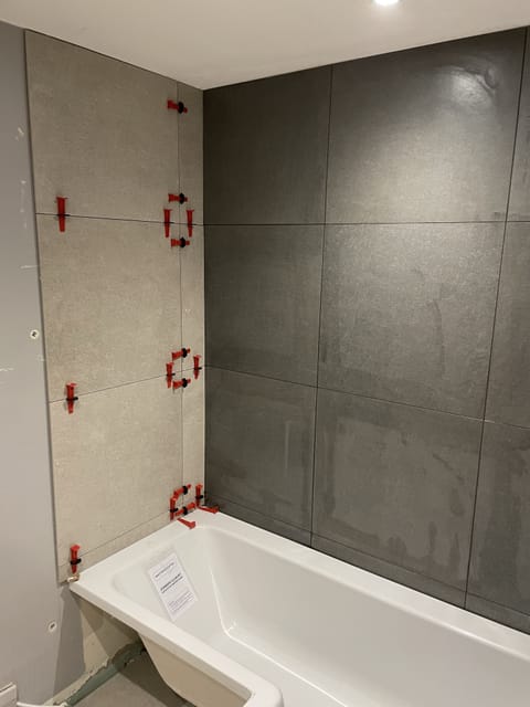 Feature wall tiling with decorative pattern, East London